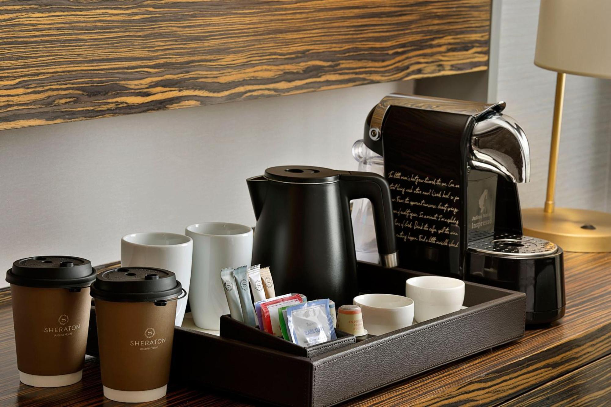 Sheraton Astana Hotel المظهر الخارجي الصورة A Nespresso coffee machine in a hotel room